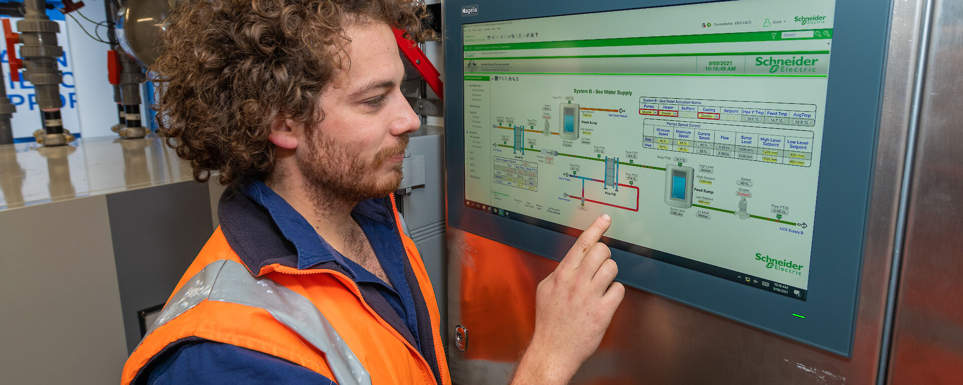 Scientist at the screen of a control panel