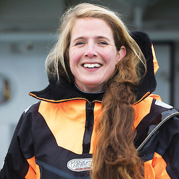 Portrait of whale researcher Elanor Bell in survival suit.