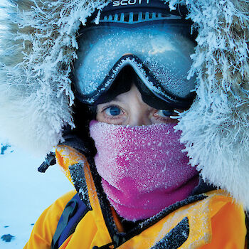 Selfie of doctor Jan Wallace with snow and ice accumulating on her clothes and goggles.
