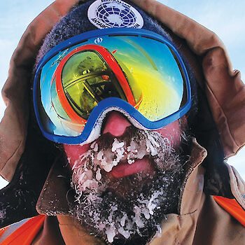 Close up of expeditioner's face with ice in beard.