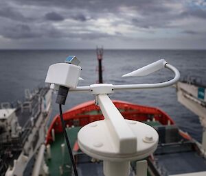 Some weather sensors looking out over the bow of a ship