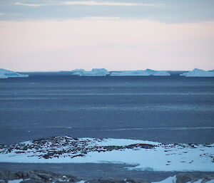 View of the last of the sea-ice with some icebergs in the distance