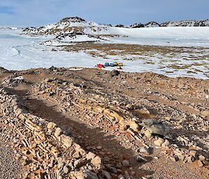 Interesting rock formations with Ledingham camp in the background at the base of the hill.