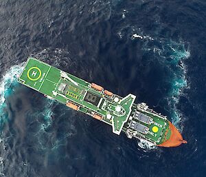 Aerial shot of the ship turning sharply in the ocean