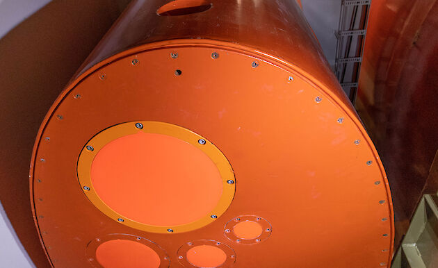 Bright orange echosounders and sonars mounted on the base of a drop keel