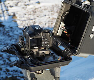 Black camera case opened for servicing whilst out in the field