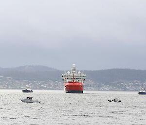 Nuyina in the Derwent with small boats nearby
