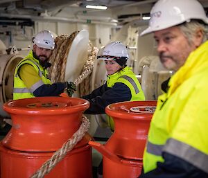 Crew with mooring ropes on the Nuyina