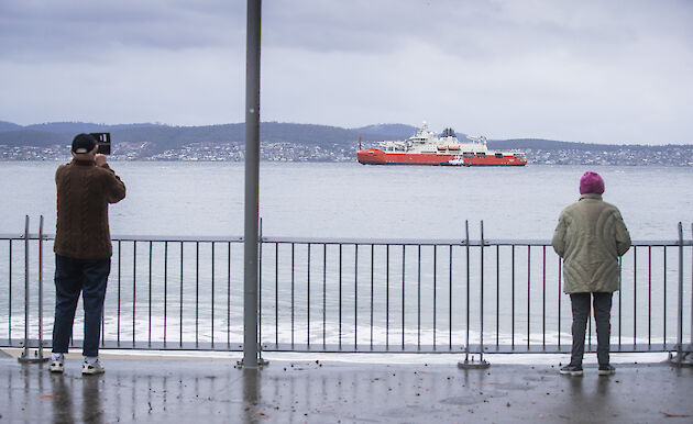 People watching the RSV Nuyina sail up the Derwent in Hobart