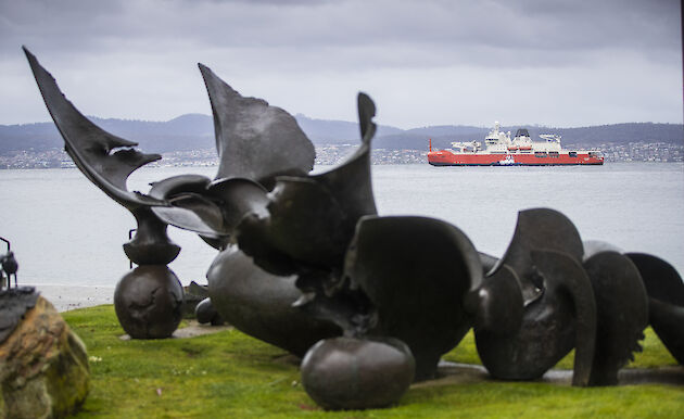 Statue in foreground; RSV Nuyina in background