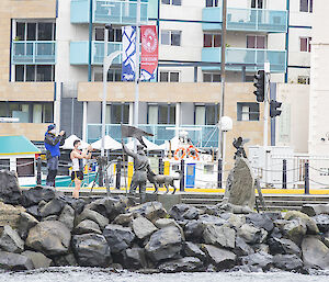People taking photos of the RSV Nuyina (out-of-frame)