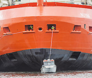 RSV Nuyina being pulled by tug