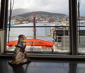Plastic guide dog on the bridge of the Nuyina looking at Hobart