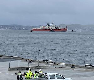 Nuyina approaching the wharf with car in the foreground
