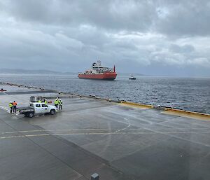 RSV Nuyina close to the wharf with car in the foreground