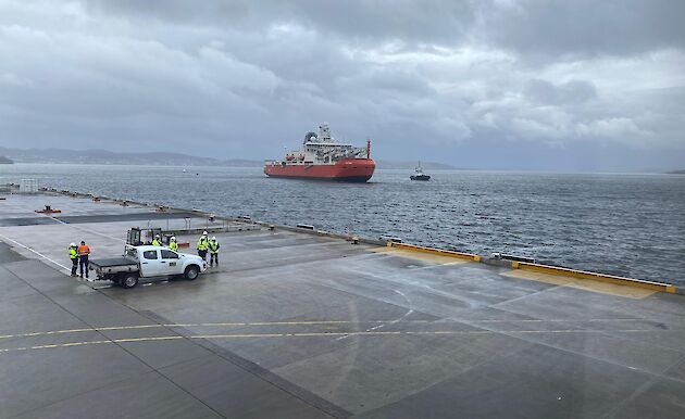 RSV Nuyina close to the wharf with car in the foreground