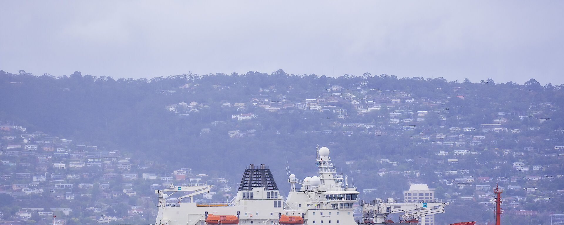 RSV Nuyina with tug boat in the Derwent