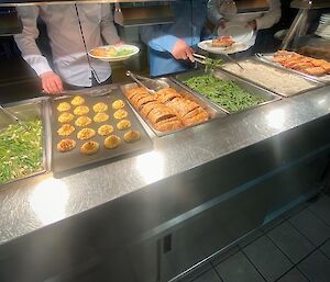 A selection of dishes for dinner held in a bain marie