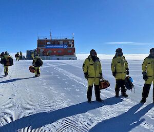 Group of expeditioners standing in front of the aerodrome