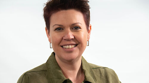 A woman smiling at the camera