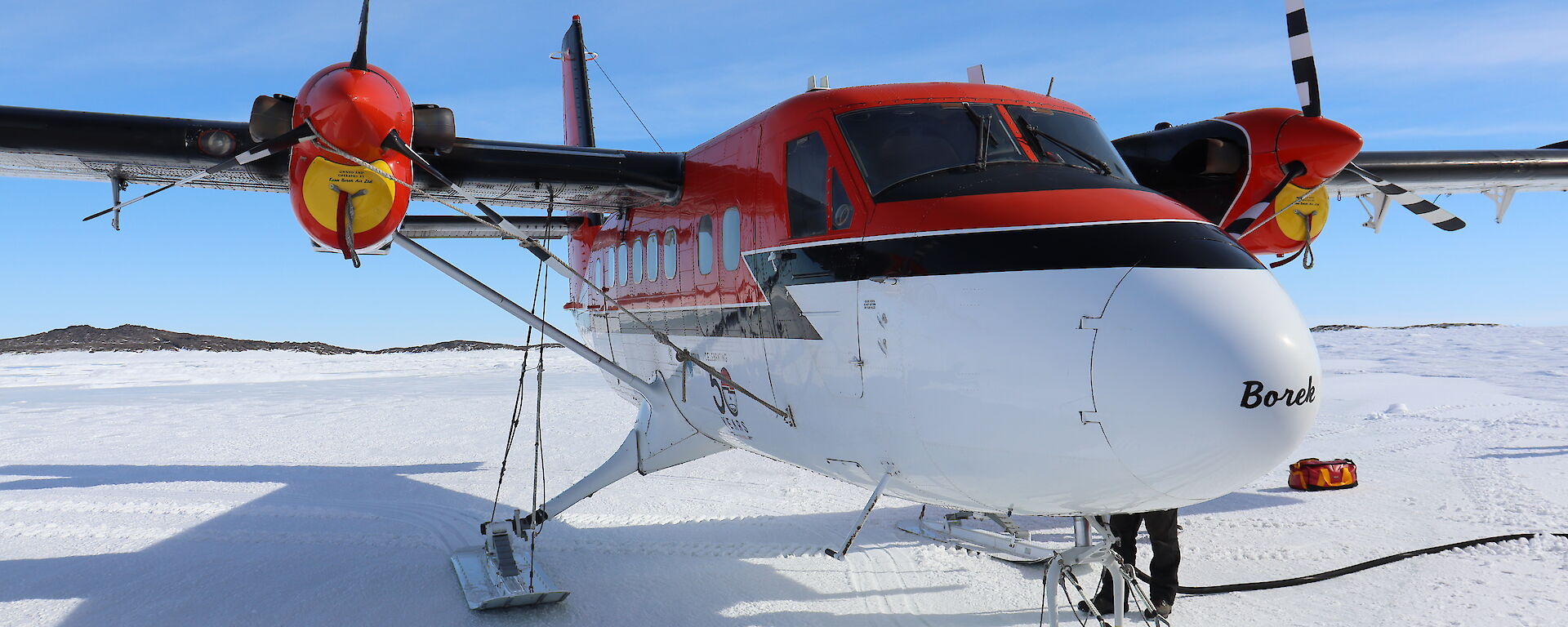 A twin otter fixed wing plane on the sea ice