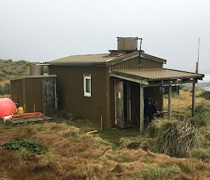 A wooden hut with a small porch