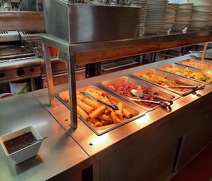 Food on display in a bain marie