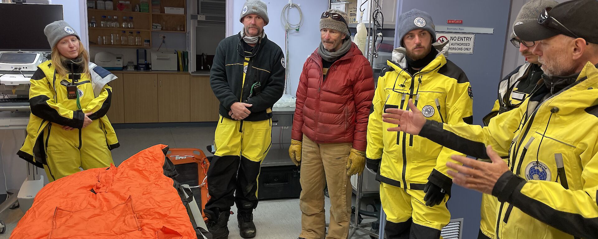 A group of expeditioners standing in the medical facility