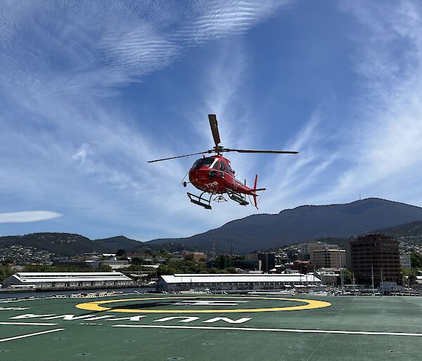 helicopter lands on ship deck