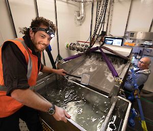 Scientists working in wet well