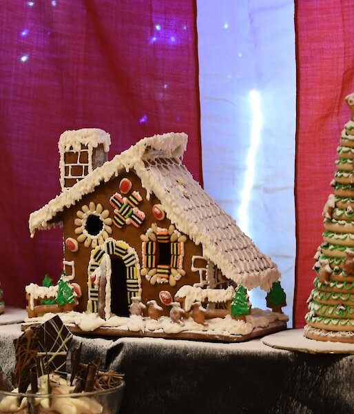 Gingerbread house complete with large gingerbread trees