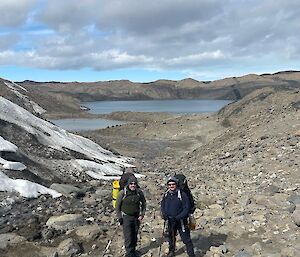 2 hikers with the Vestfold hills in the background