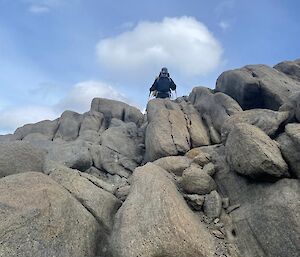 A hiker on top of some rocks