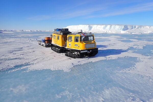 The Mawson Yellow Hägglunds on the sea ice in front of the Forbes Glacier