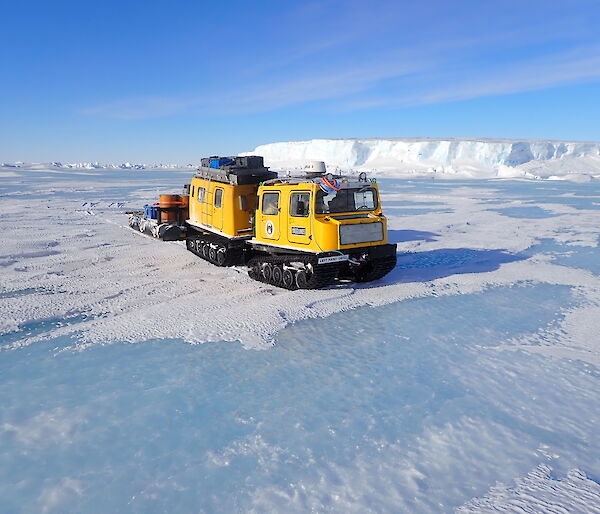 The Mawson Yellow Hägglunds on the sea ice in front of the Forbes Glacier