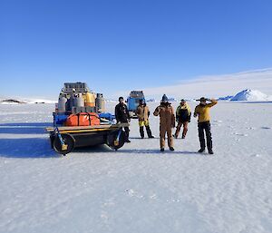 Two Hägglunds with laden sleds on the sea ice on the way to Ledinghams Depot