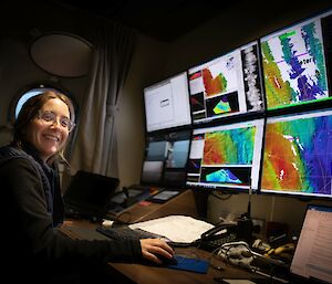 woman in front of computer screens