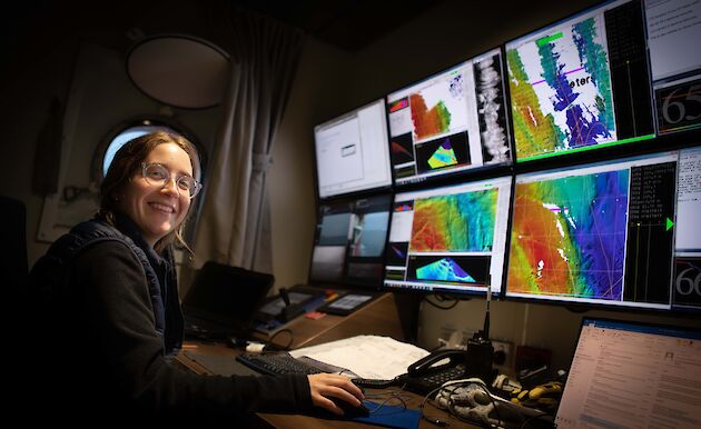 woman in front of computer screens