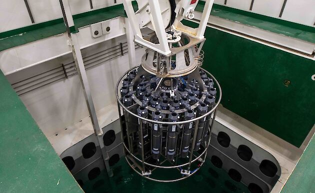 water sampler lowered into pool inside ship