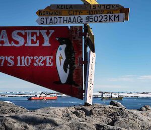 Casey sign in foreground with two ships in background