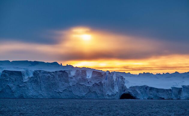 ice cliff in coloured light