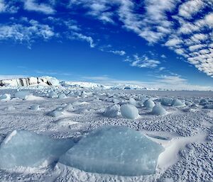 A view of ice cliffs to the east of Mawson from the edge of the sea ice that has recently formed