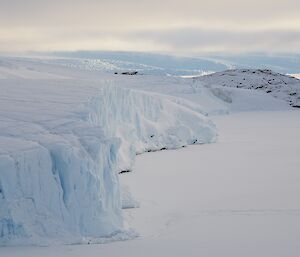 The ice cliffs and newly formed sea ice to the west of Mawson station