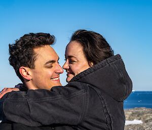 A couple hugging and smiling