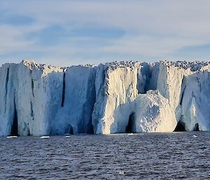 A glacier in front of the water