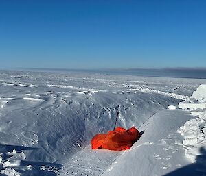 A large man-made hole in the snow