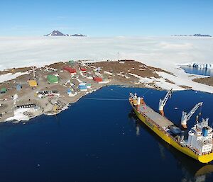 A view of a cargo ship and Mawson research station from the sky