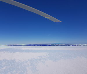 An aerial view of ice and the brilliant blue sky