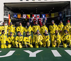 Picture showing the new team on the helideck of the new ship Nuyina