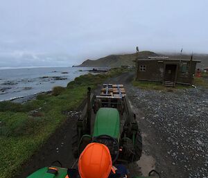 Tractor carrying a load during resupply